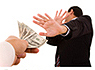 man gesturing 'no' to money being handed to him
