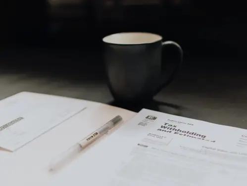 tax form and coffee mug