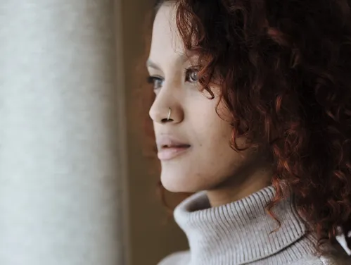 woman looking outside