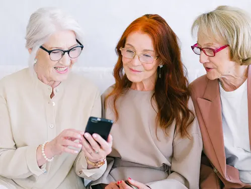 mature women looking at cell phone