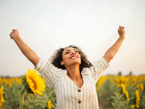 Woman in Field of Sunflowers