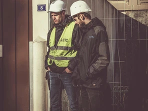 Two men in safety PPE