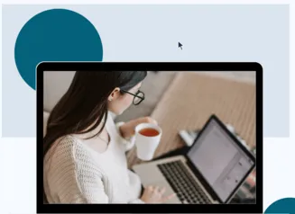 woman holding a mug with tea, looking at a laptop