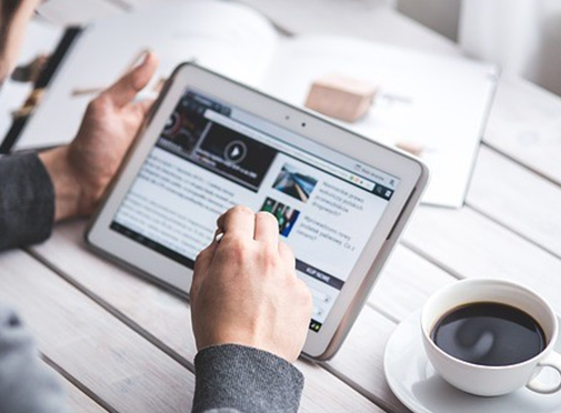 man looking at ipad