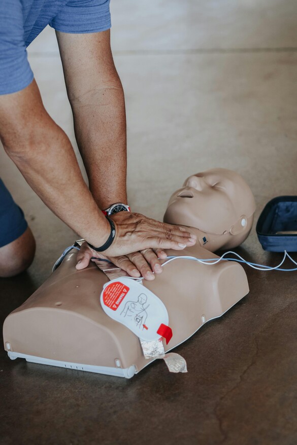 Man doing CPR on a dummy