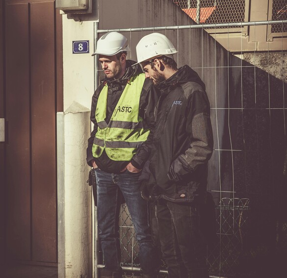Two men in safety PPE