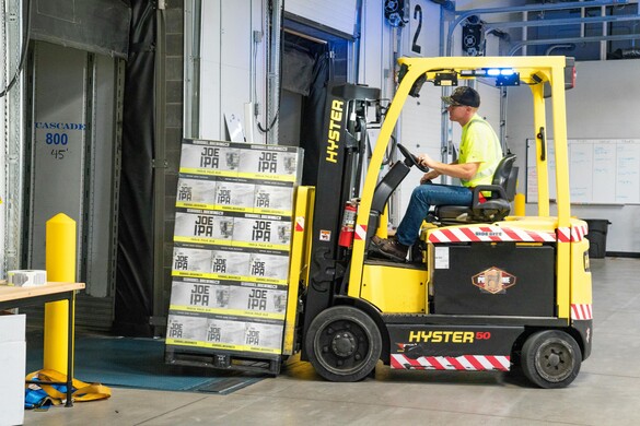 Worker on forklift